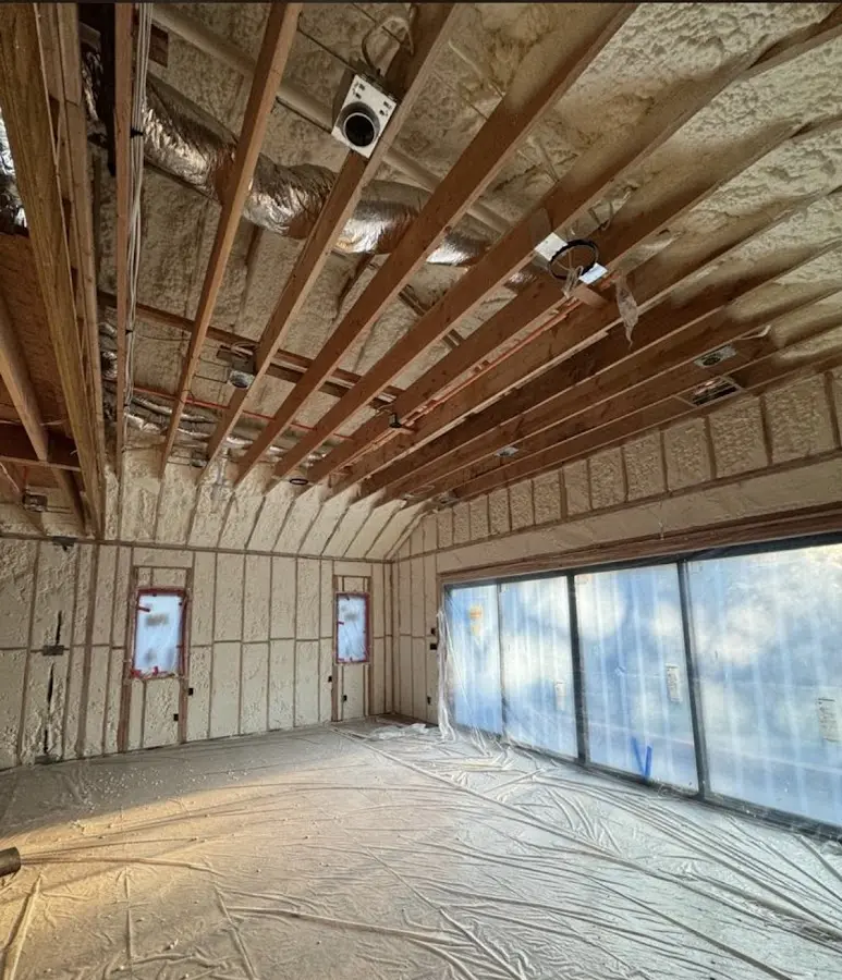 Interior walls and ceiling insulated with spray foam during new construction in Micco